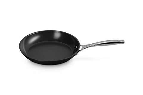 Le Creuset Essential 10-inch fry pan with even heat distribution for searing and sautéing.