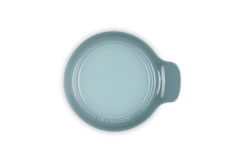 Le Creuset glazed spoon rest Sea Salt surface is virtually nonstick for quick cleanup.