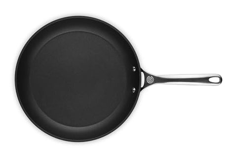 Le Creuset hard anodized aluminum delivers quick, even heating.