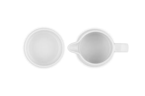 Le Creuset heat-retention stoneware during serving keeps cream cool longer.