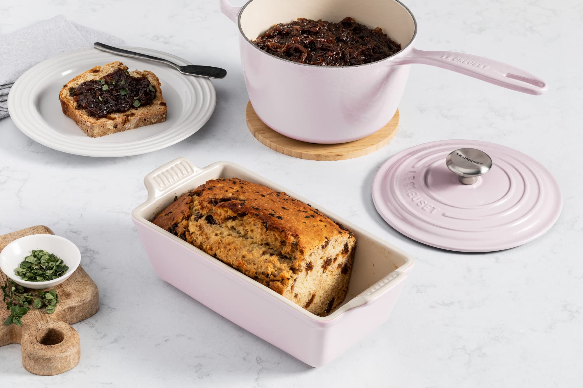 Le Creuset Heritage Loaf Pan shallot close-up glaze emphasizes nonporous finish and stain resistance.