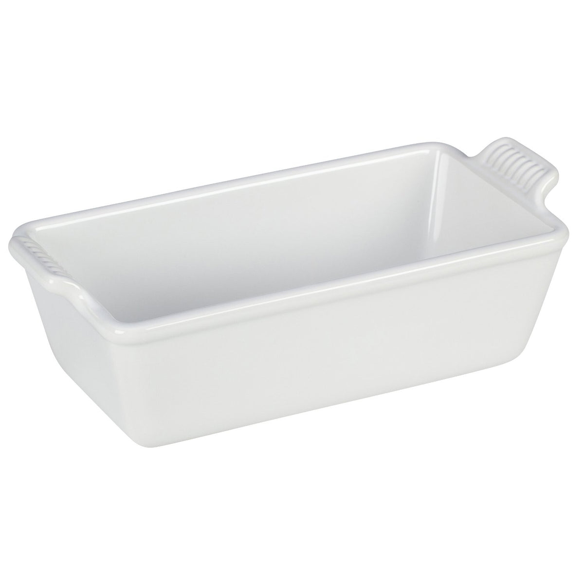Le Creuset Heritage loaf pan showing even browning and vibrant glaze.