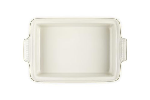 Le Creuset Heritage olive casserole interior glaze provides easy food release.