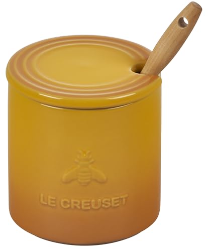 Le Creuset Nectar honey pot on the countertop showing vibrant glaze.