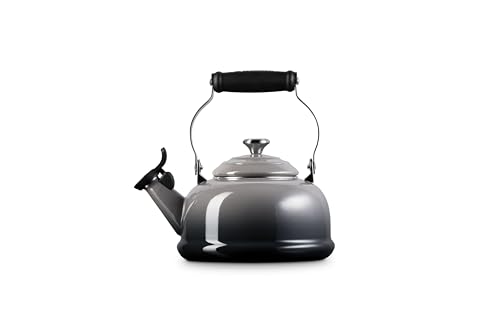 Le Creuset kettle close-up shows embossed cartouche on the handle.