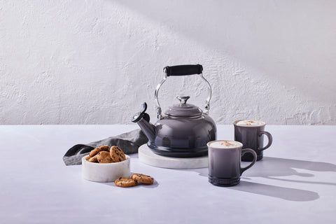 Le Creuset whistle emits a clear boil cue for safe pouring.