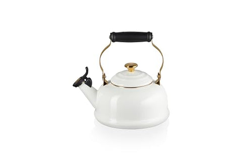 Le Creuset kettle features stay-cool handle with gold accents for safe pouring