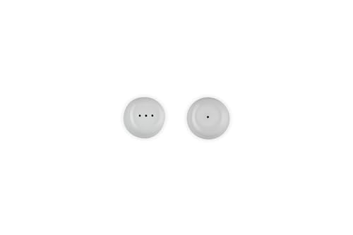 Le Creuset table setting featuring white shakers for daily dining.