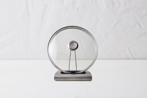 Le Creuset lid holder combines elegant design with practical kitchen use