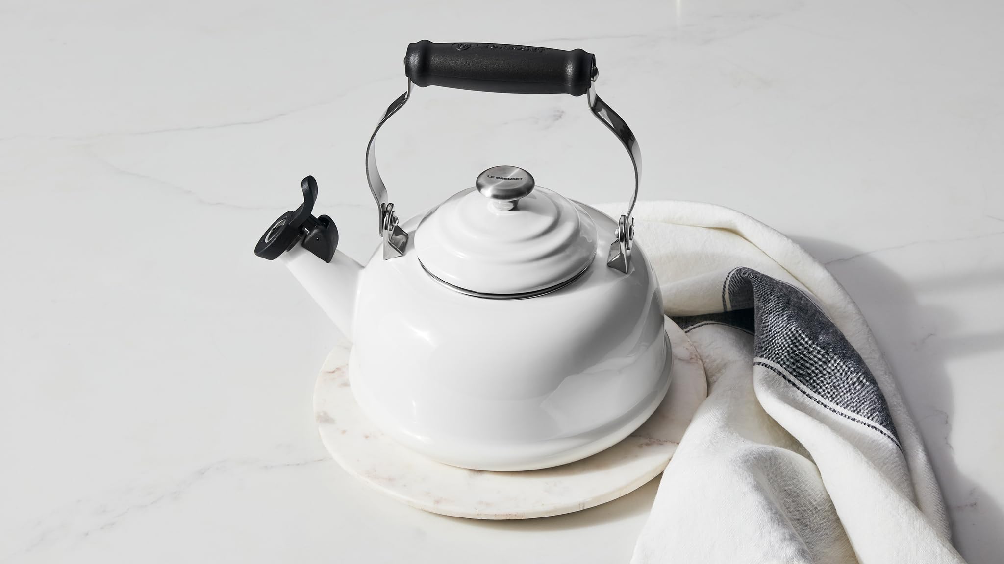 Le Creuset Marseille enamel kettle on stove ready for rapid boiling mornings.