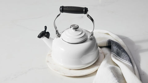 Le Creuset Marseille enamel kettle on stove ready for rapid boiling mornings.