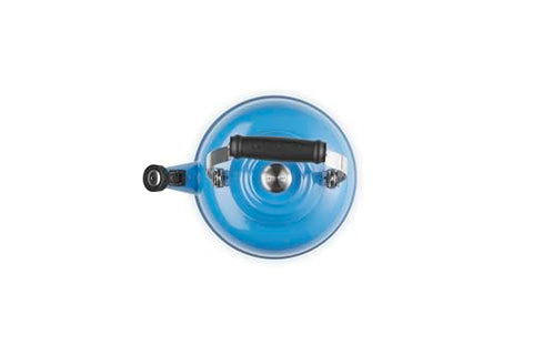 Le Creuset Marseille enamel kettle whistle indicates boiling readiness for safe pouring.