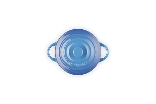 Le Creuset Marseille mini cocotte lid with knob traps heat for even cooking.