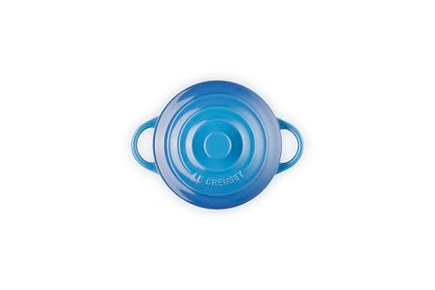 Le Creuset Marseille mini cocotte lid with knob traps heat for even cooking.