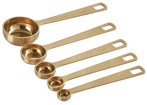 Le Creuset gold measuring spoons set highlights 1-2-tsp for recipe accuracy.