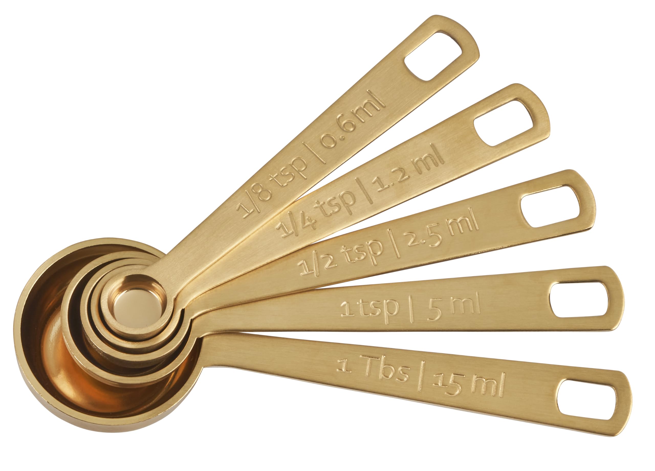 Le Creuset gold measuring spoons with 1-8-tsp precision for baking.