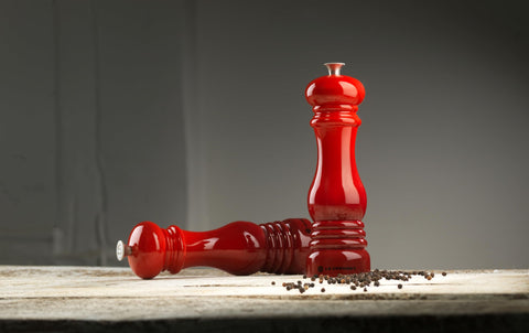 Le Creuset MG610-67 salt and pepper mills on dining table ready for use