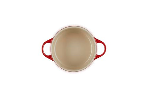 Le Creuset cerise cocotte lid fits securely, trapping moisture for tender results