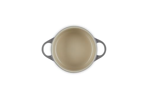 Le Creuset oyster cocotte interior enamel resists sticking and cleans easily.