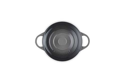 Le Creuset 14 oz oyster cocotte with lid on, traps heat for moist, flavorful results.