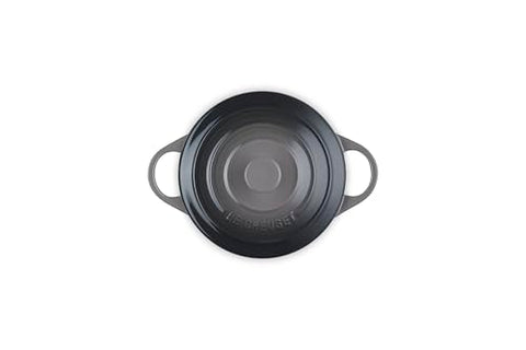 Le Creuset 14 oz oyster cocotte with lid on, traps heat for moist, flavorful results.
