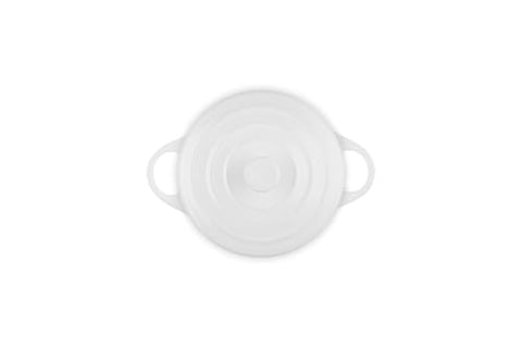Le Creuset mini round cocotte white with loop handles, easy transport.