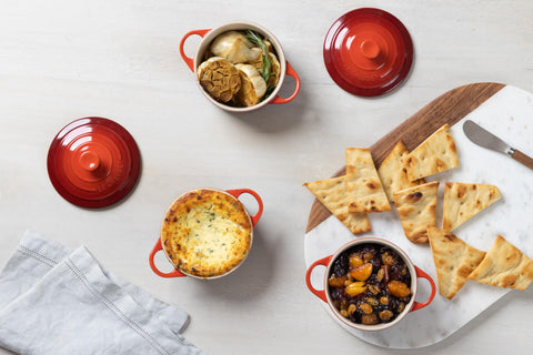 Le Creuset mini round cocotte cerise, freezer to oven readiness for meal prep flexibility.
