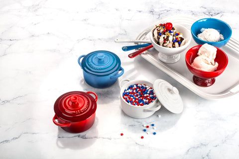 Le Creuset mini round cocotte cerise, dish-safe with metal utensils for durable family use.