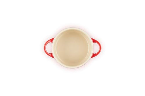 Le Creuset mini round cocotte cerise, oven-ready pot for quick weeknight gratins and desserts.
