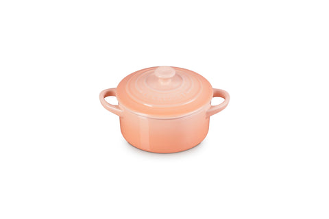 Le Creuset mini cocotte Peche with heart knob for sharing delightful desserts.