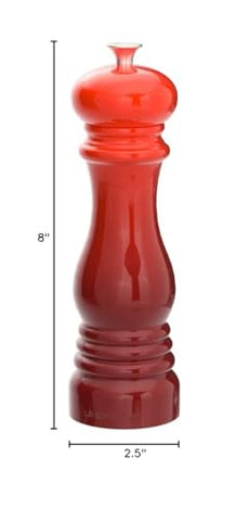 Le Creuset Cerise pepper mill shown on table as a stylish tabletop display