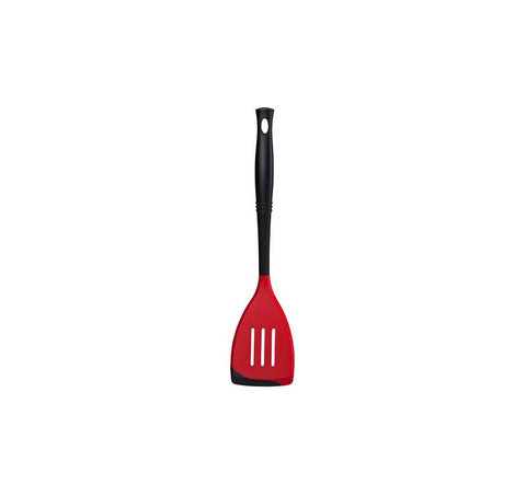 Le Creuset Revolution bi-material spatula ergonomic handle view highlights comfortable scooping.