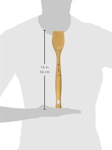 Le Creuset Revolution beech wood spoon, blunt end safely scrapes pan bottoms during sautéing