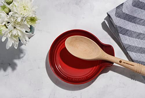 Le Creuset Revolution Solid Spoon in beech wood, ideal for nonstick cookware and elegant table service.