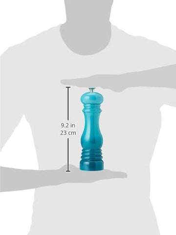Le Creuset salt mill complements kitchen decor with adjustable grind.
