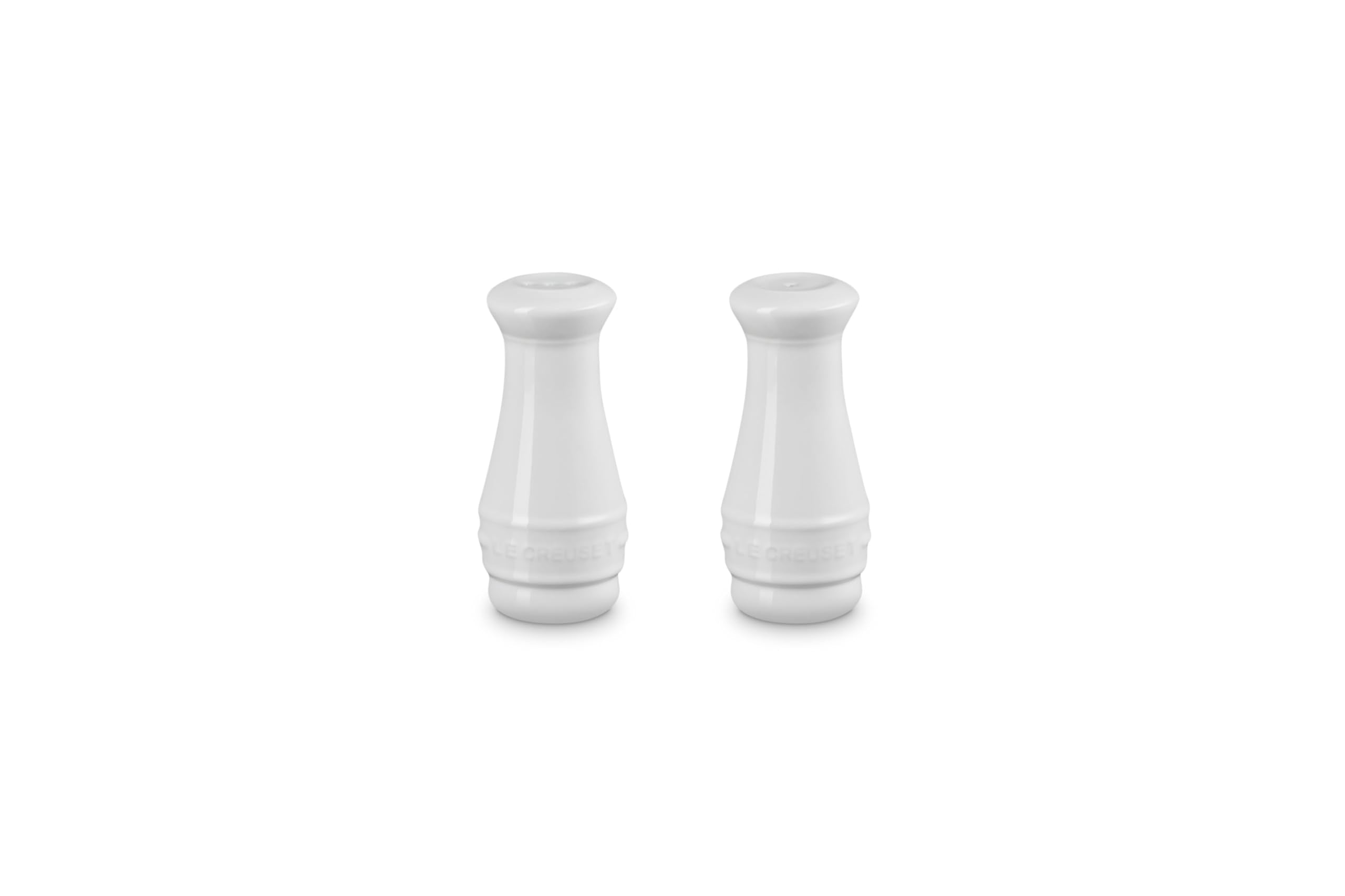 Le Creuset salt and pepper shaker set in white on display, ideal for everyday seasoning.