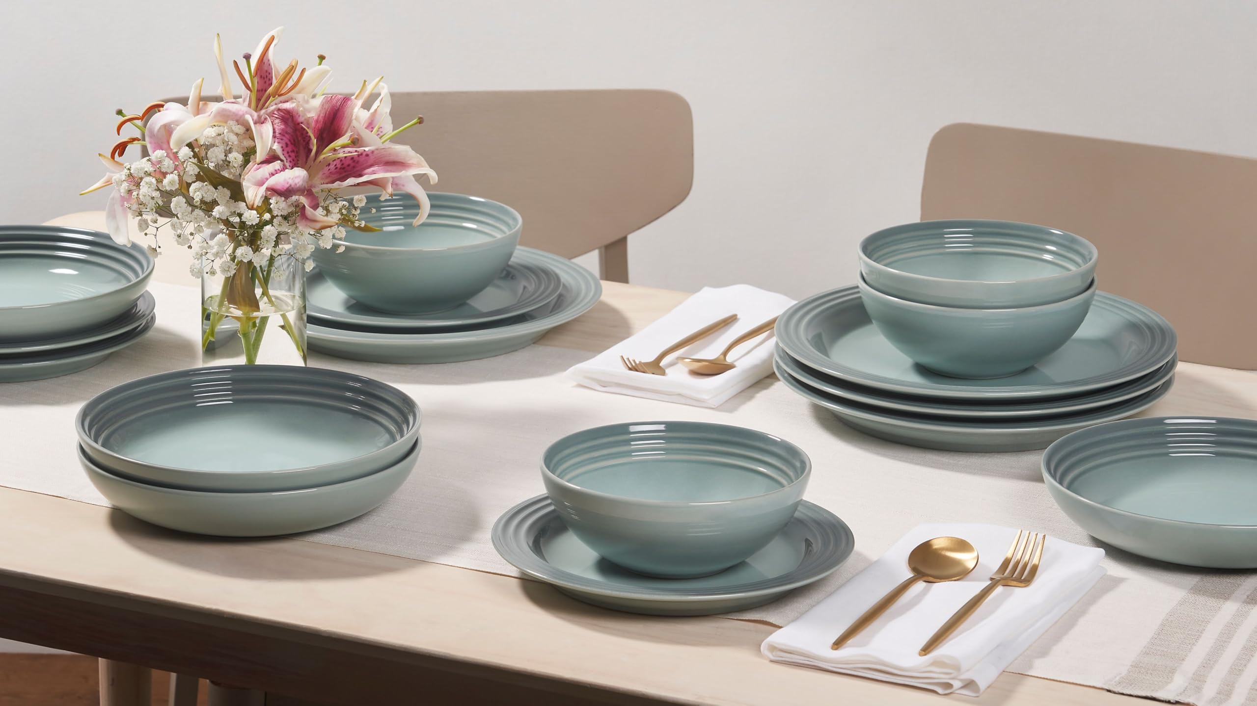 Le Creuset heat-retention glaze keeps soups warm at the table.