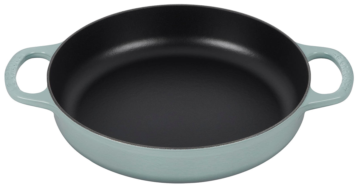 Le Creuset Signature cast iron pan demonstrates even heat distribution for browning.