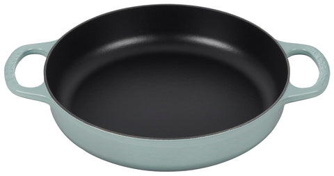 Le Creuset Signature cast iron pan demonstrates even heat distribution for browning.