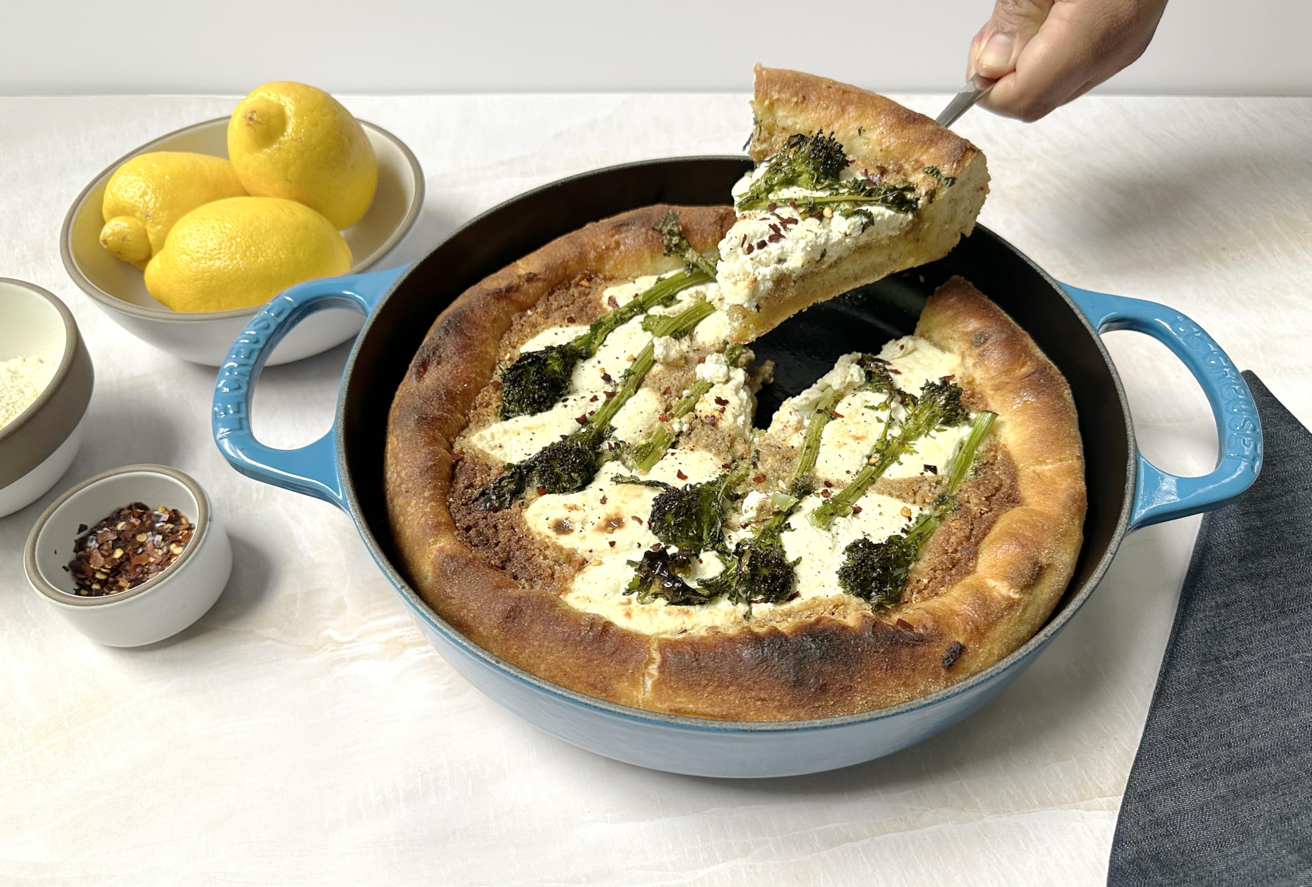 Le Creuset Marseille pan; exterior enamel resists staining and chipping for long-lasting color.