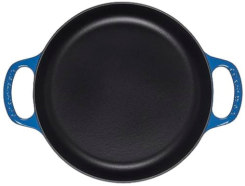 Le Creuset Signature Marseille pan; overhead view emphasizes wide surface for pan roasting.