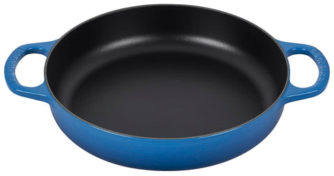 Le Creuset Signature cast iron Marseille pan; side view shows versatile everyday use with even heat.
