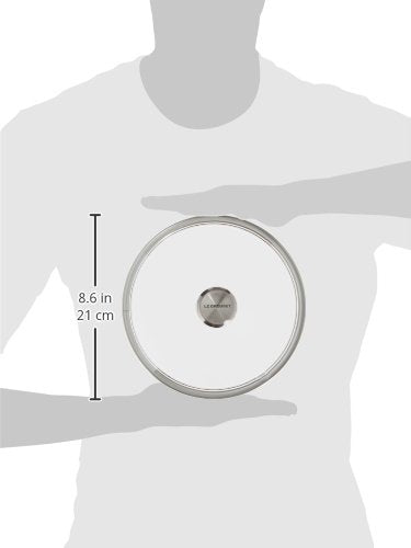 Le Creuset glass lid with stainless steel knob close-up, durable seal for even heat and moisture