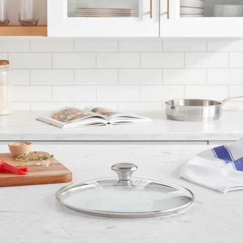 Le Creuset Signature glass lid with stainless steel knob keeps moisture in and monitoring easy