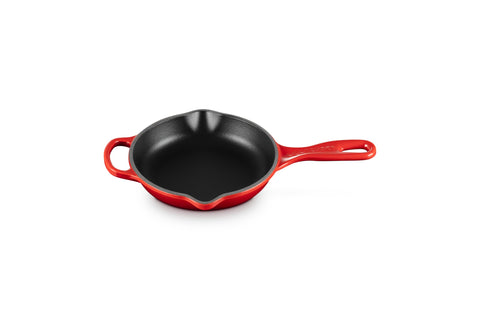 Le Creuset Signature iron handle skillet in Cerise overview highlighting even heat distribution.
