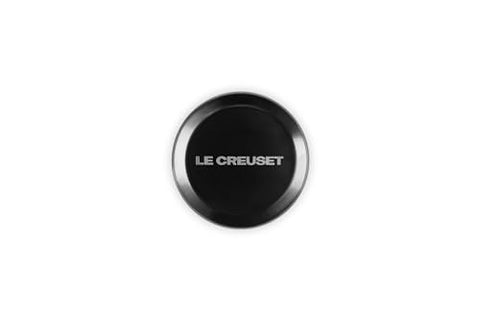 Knob ergonomic grip demonstrated for comfortable turning on Le Creuset pots.