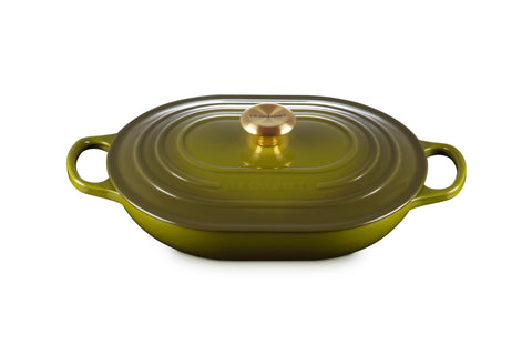Le Creuset Signature oval casserole in olive ready for use with even heat distribution.