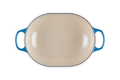 Le Creuset Marseille oval casserole in oven with roast visible inside.