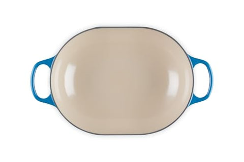 Le Creuset Marseille oval casserole in oven with roast visible inside.