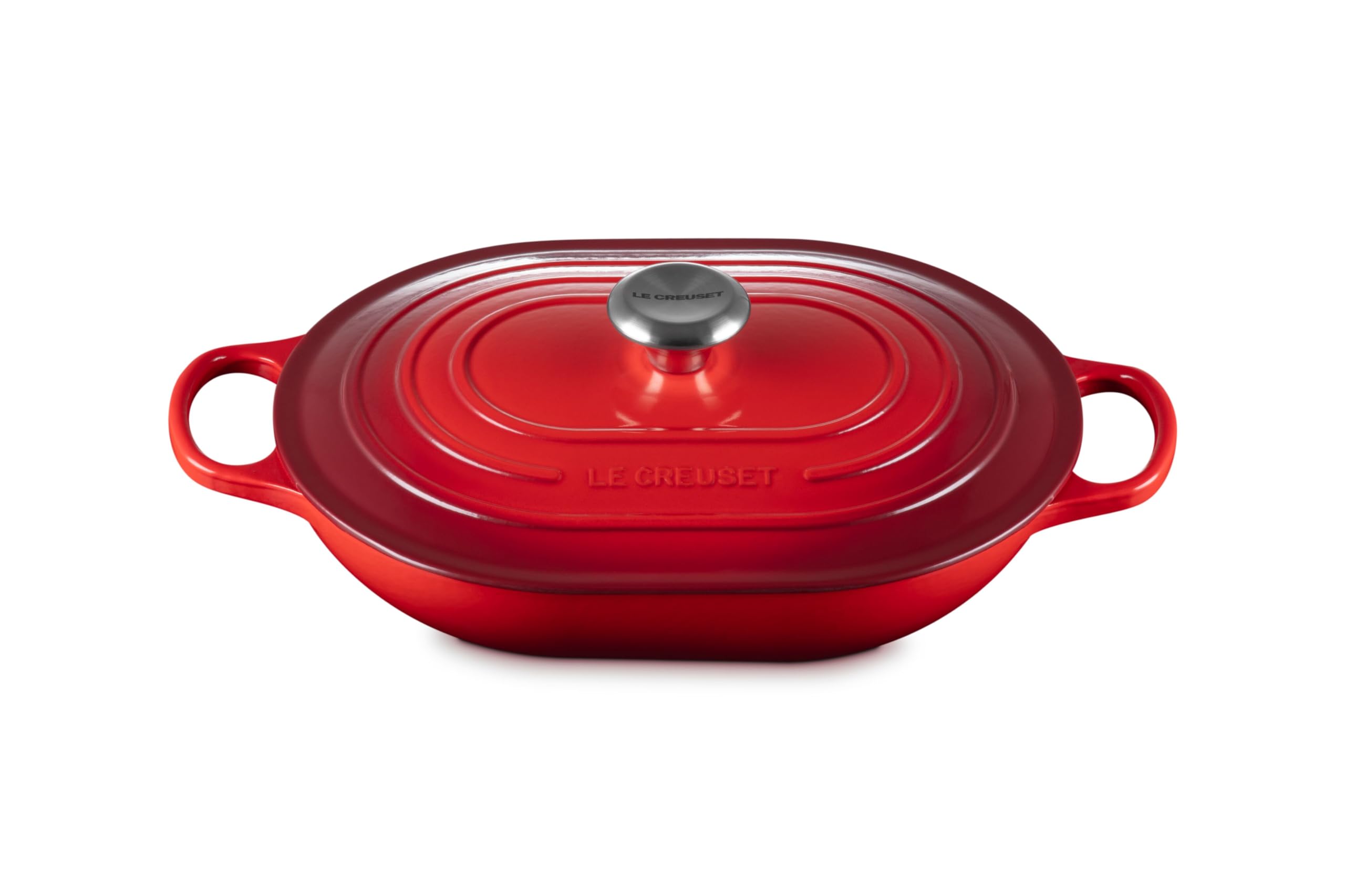 Le Creuset Signature oval casserole with lid in cerise, ready for family meals.